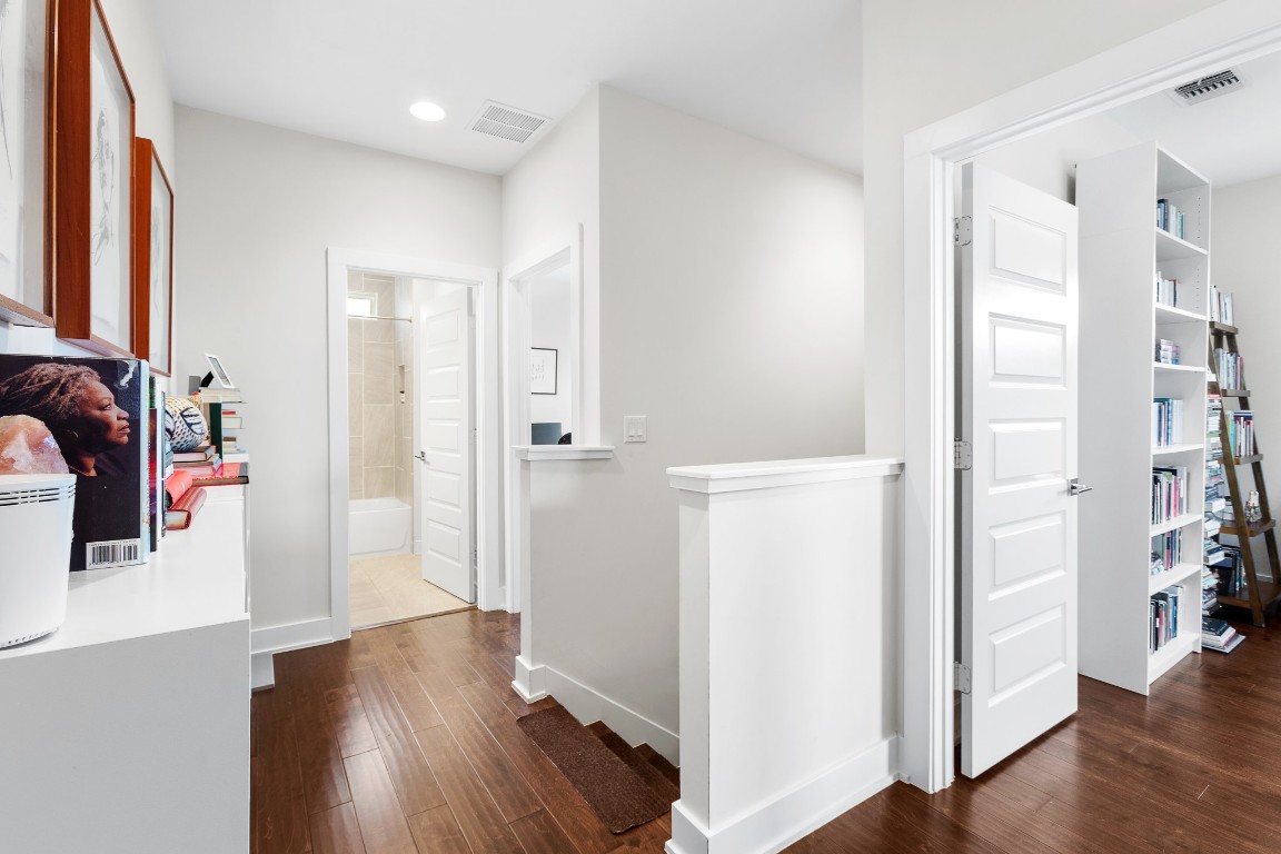 3101 Sunnylawn Circle, Unit B Austin, TX 78723 - Photo 20 of 28 Corridor with dark wood-style flooring, an upstairs landing, and recessed lighting
