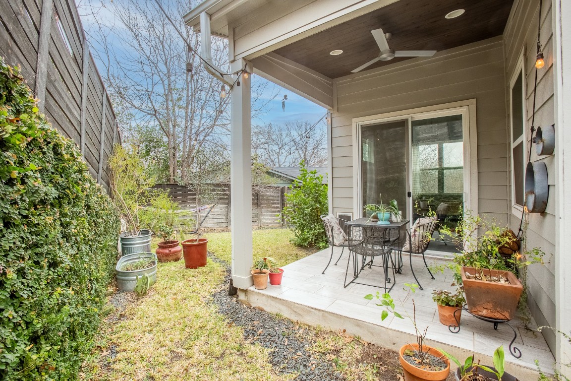 3101 Sunnylawn Circle, Unit B Austin, TX 78723 - Photo 23 of 28 Fenced backyard with a ceiling fan, a patio area, and outdoor dining area