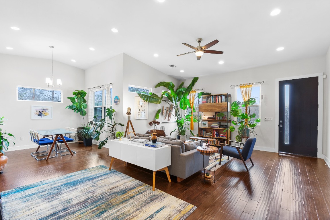 3101 Sunnylawn Circle, Unit B Austin, TX 78723 - Photo 5 of 28 Living room featuring dark wood-type flooring, ceiling fan, recessed lighting, and a chandelier