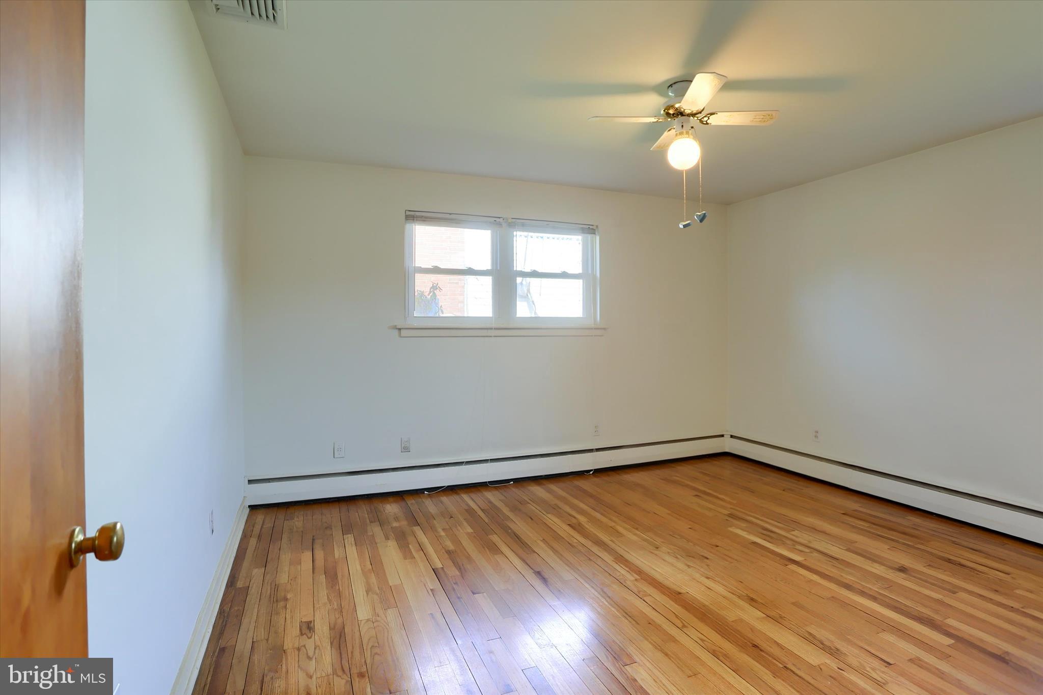 3802 Darby Road Harrisburg, PA 17109 - Photo 12 of 33 wooden floor in an empty room with a window