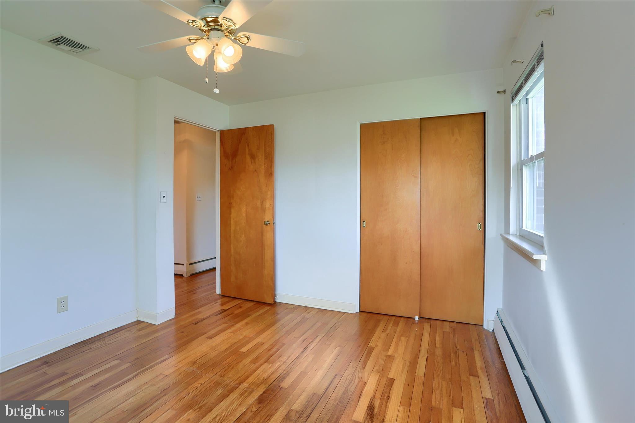 3802 Darby Road Harrisburg, PA 17109 - Photo 17 of 33 a view of empty room with wooden floor and fan