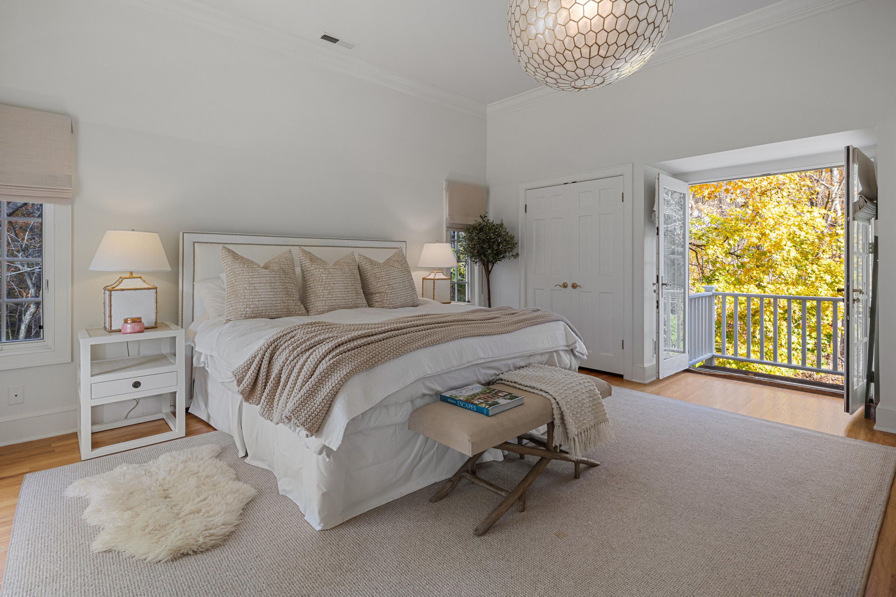 95 Ludlowe Road New Canaan, CT 06840 - Photo 16 of 37 a bedroom with a bed and a chandelier