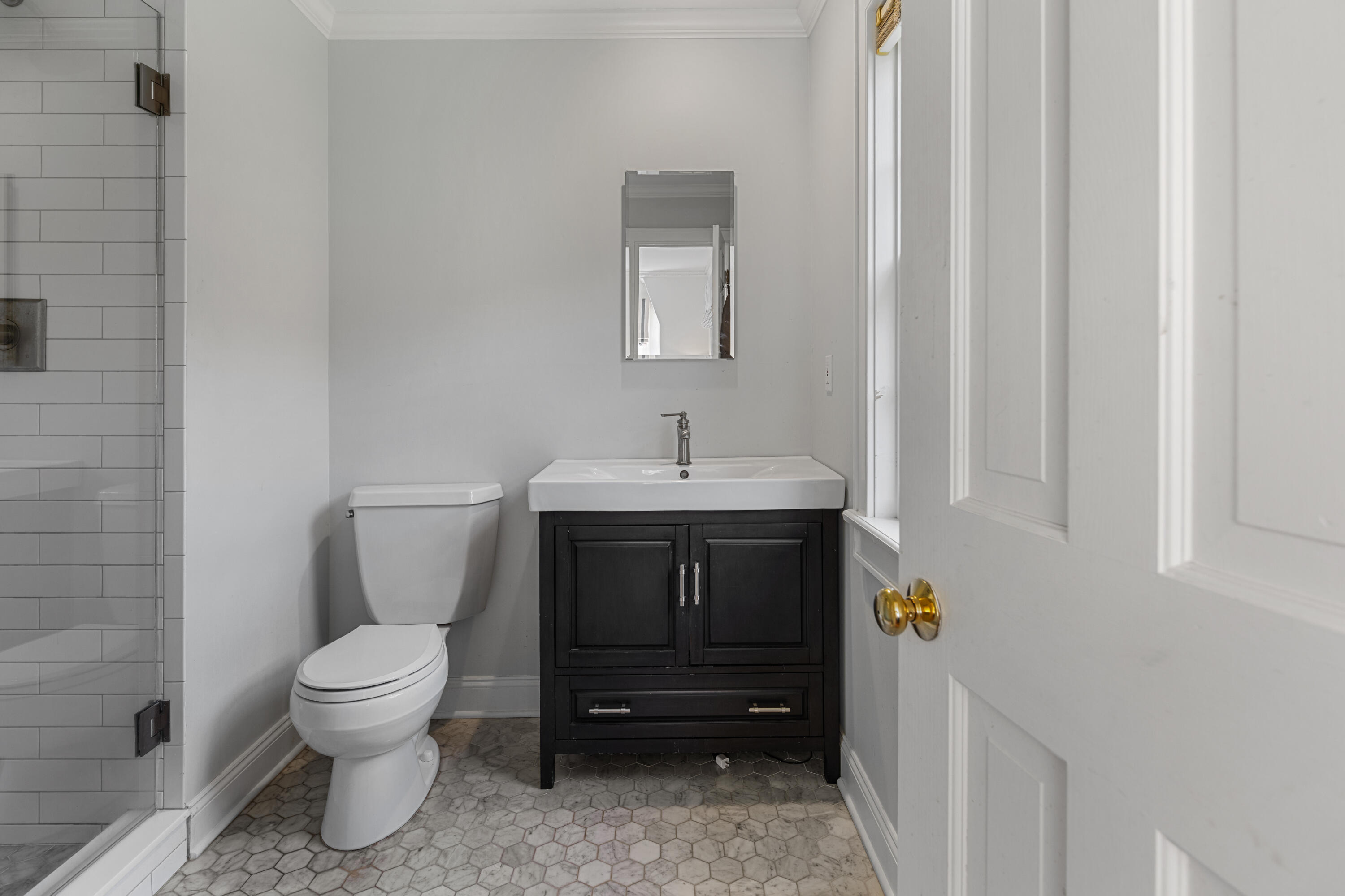 95 Ludlowe Road New Canaan, CT 06840 - Photo 21 of 37 a bathroom with a sink a toilet and a mirror