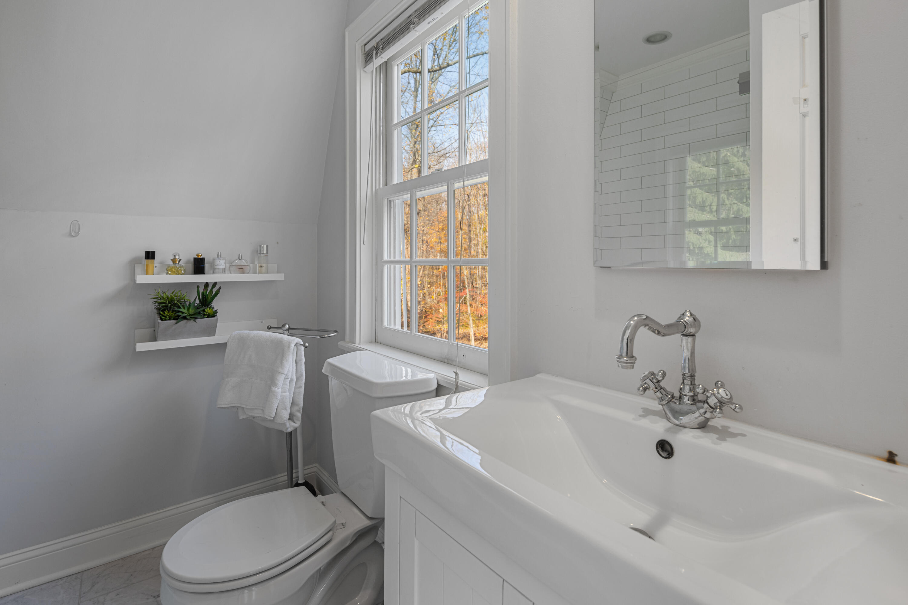 95 Ludlowe Road New Canaan, CT 06840 - Photo 26 of 37 a bathroom with a sink a toilet and a window