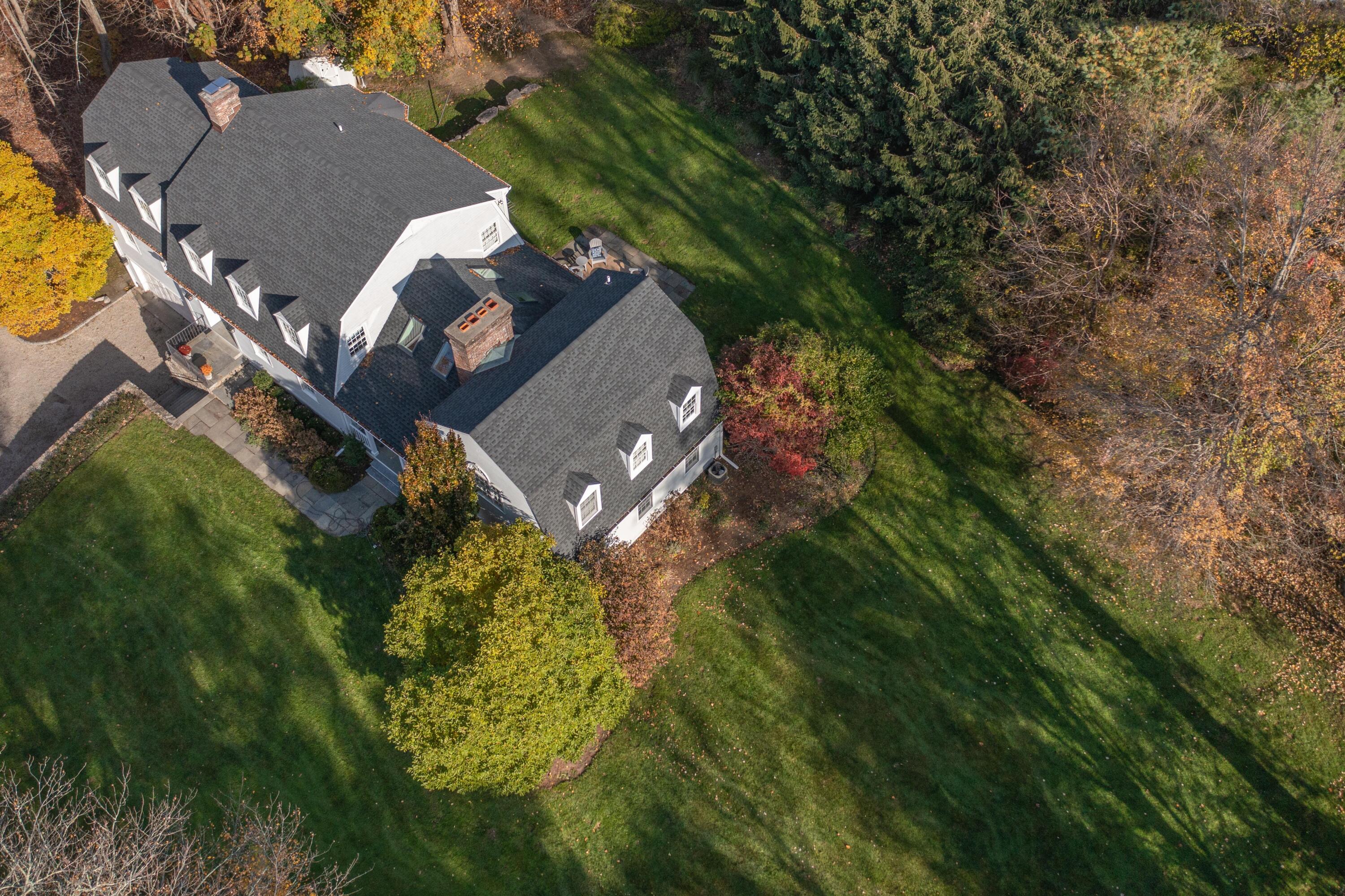 95 Ludlowe Road New Canaan, CT 06840 - Photo 34 of 37 an aerial view of a house with a yard basket ball court and outdoor seating