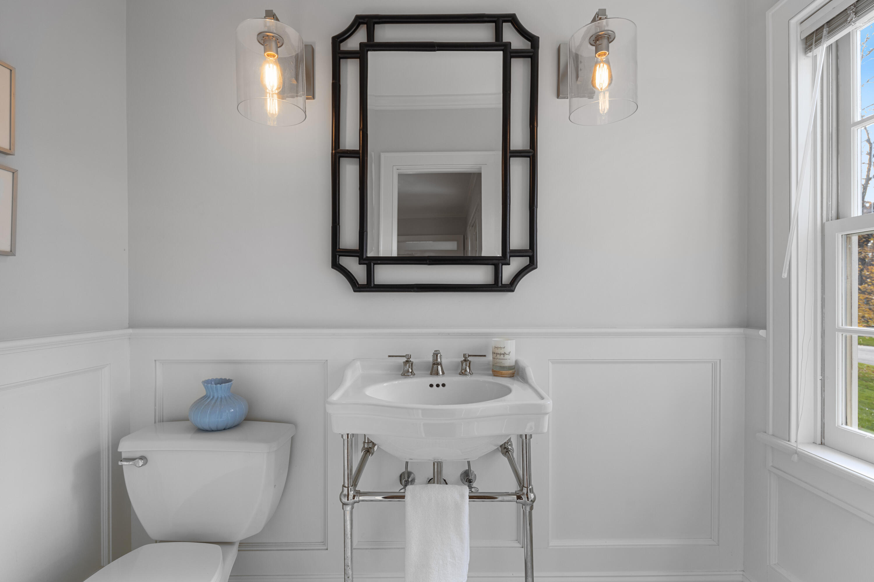 95 Ludlowe Road New Canaan, CT 06840 - Photo 8 of 37 a bathroom with a toilet sink and mirror