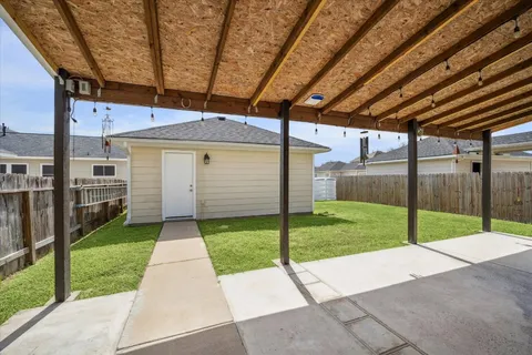 a view of a backyard with porch