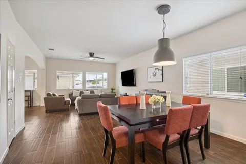 a view of a dining room with furniture window and wooden floor