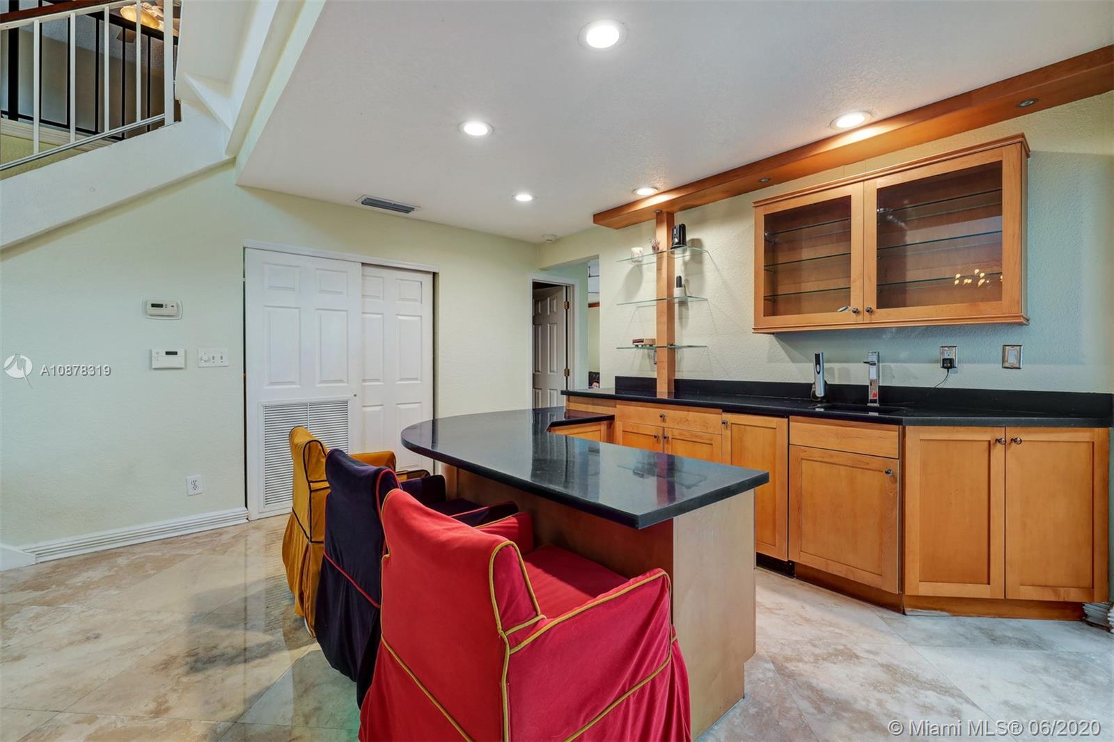 74 Ivy Road Hollywood, FL 33021 - Photo 13 of 55 a kitchen with stainless steel appliances granite countertop a sink a stove and a refrigerator