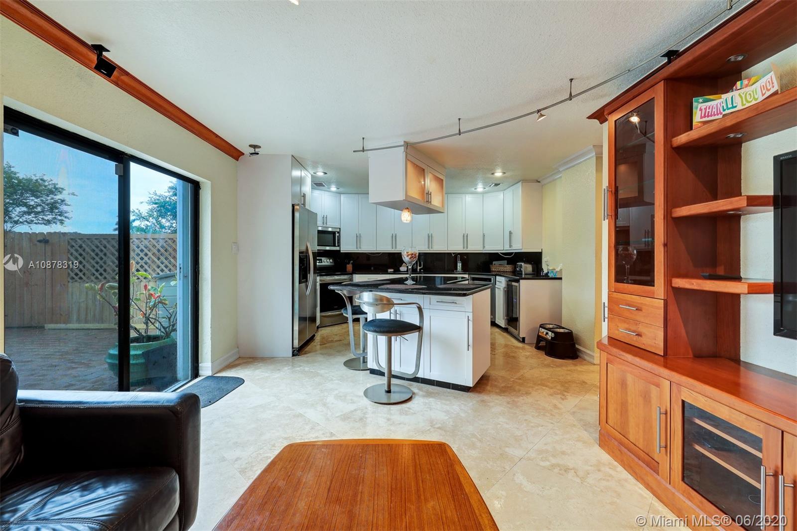 74 Ivy Road Hollywood, FL 33021 - Photo 18 of 55 a kitchen with a sink cabinets and stainless steel appliances