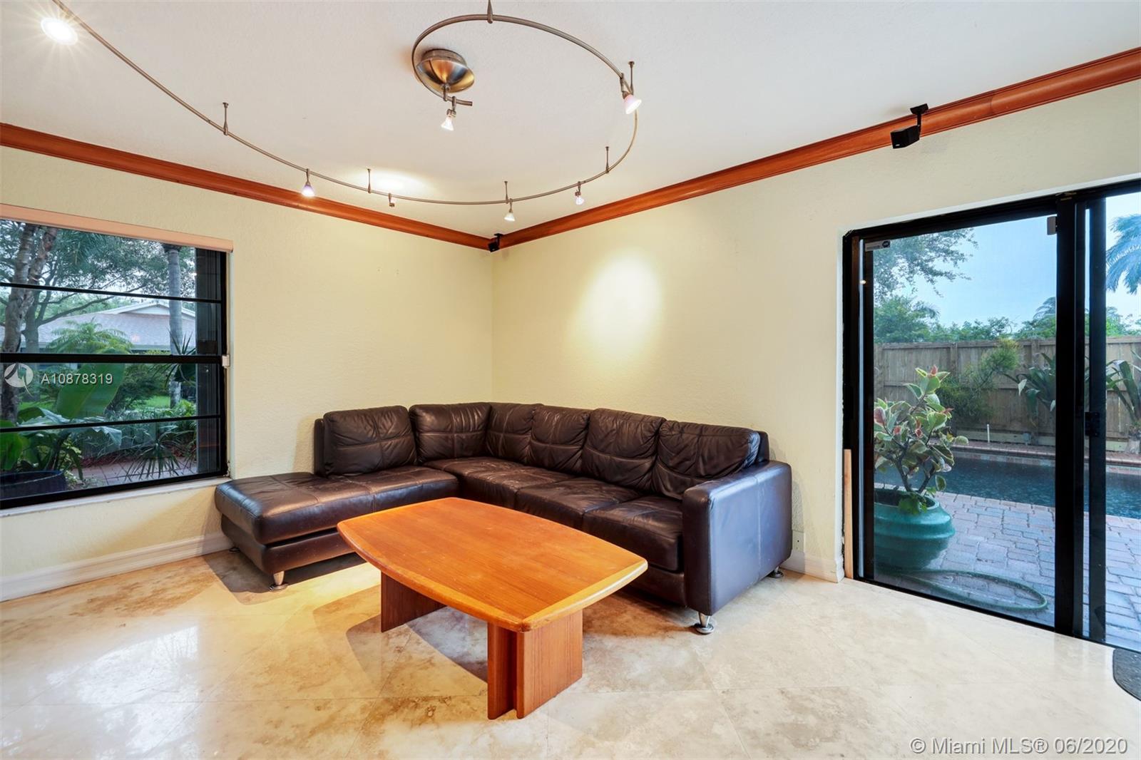 74 Ivy Road Hollywood, FL 33021 - Photo 20 of 55 a living room with furniture and a large window