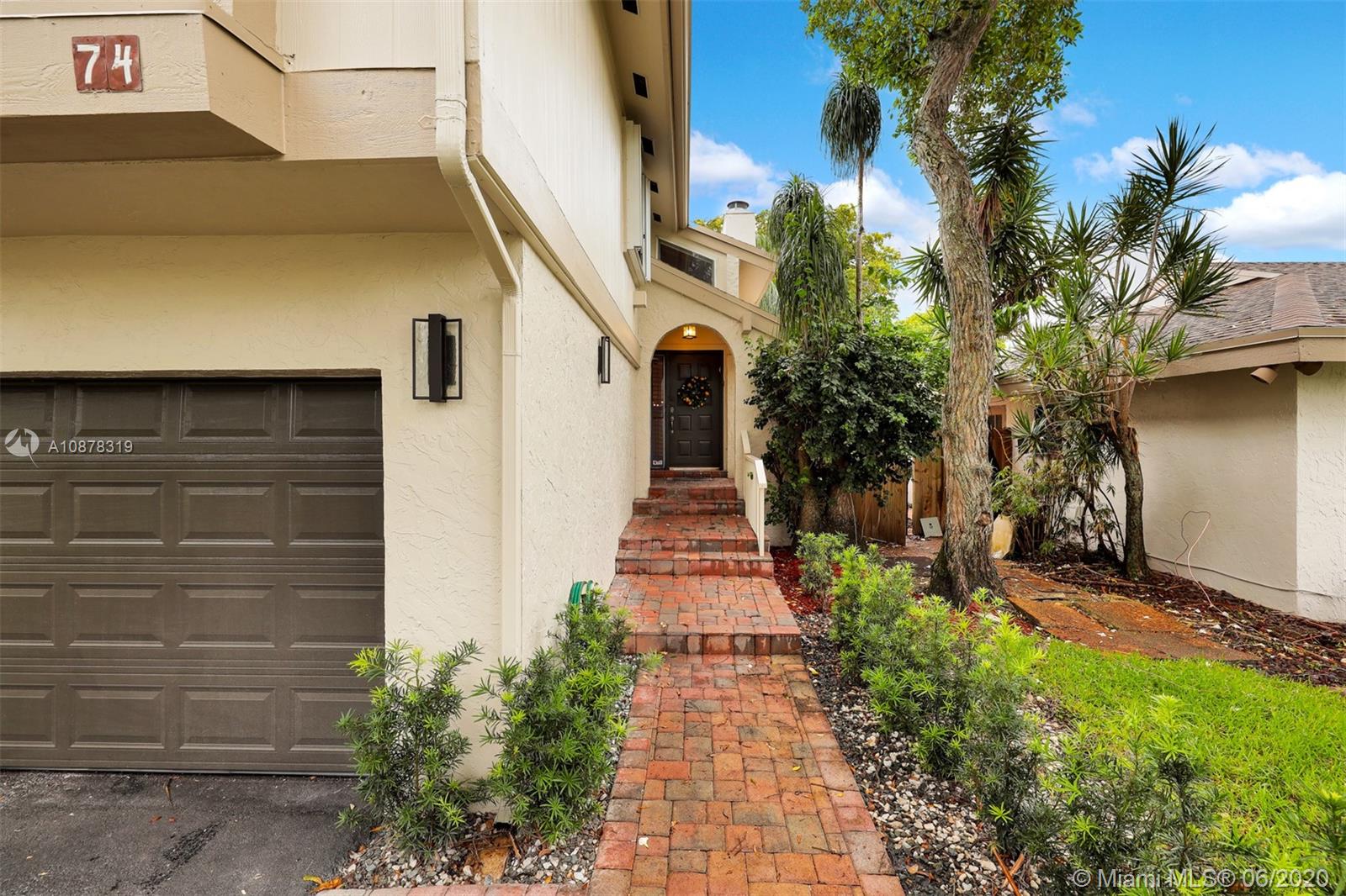 74 Ivy Road Hollywood, FL 33021 - Photo 2 of 55 a view of a pathway of house with potted plants
