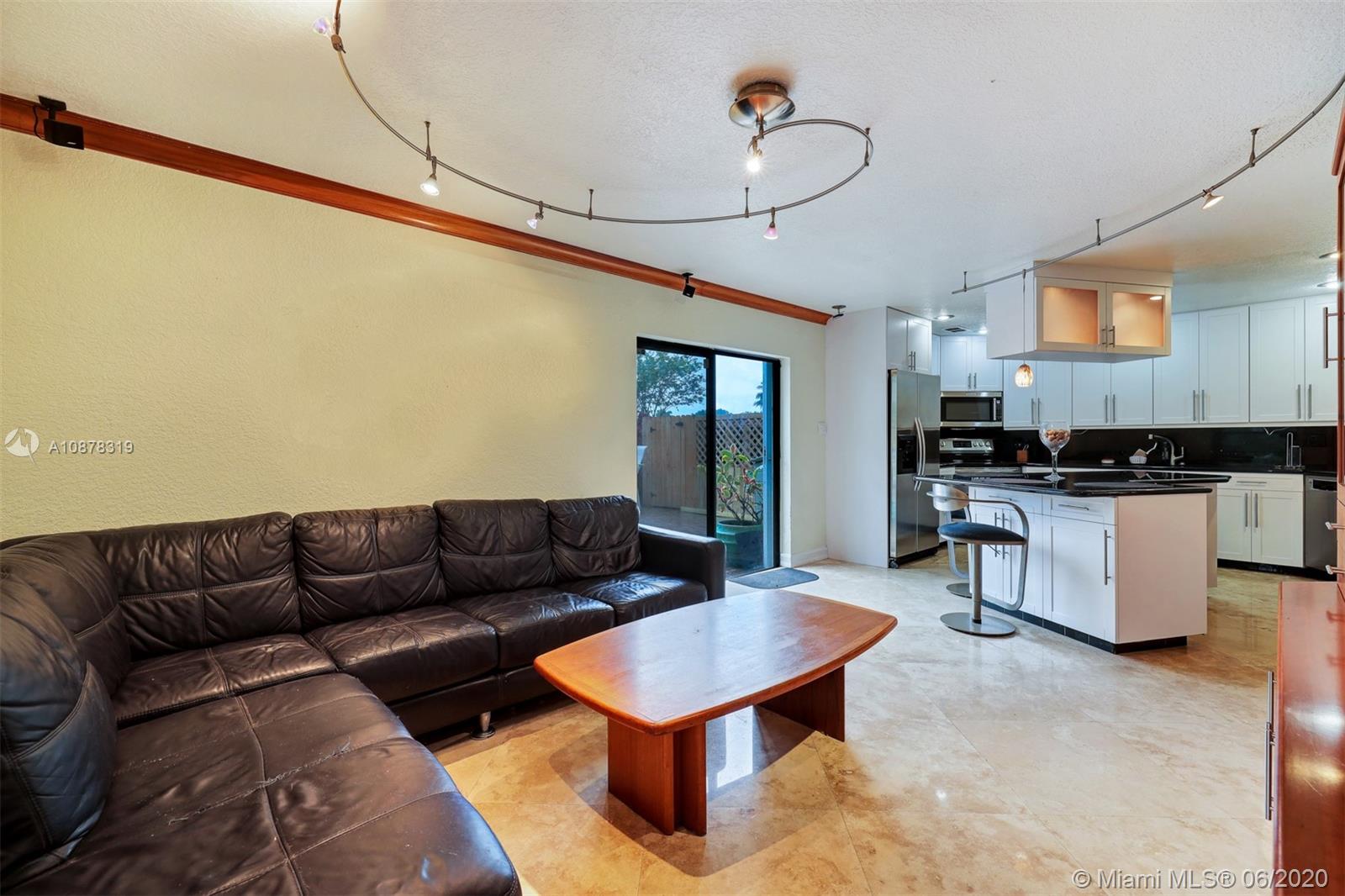 74 Ivy Road Hollywood, FL 33021 - Photo 21 of 55 a living room with furniture and kitchen view