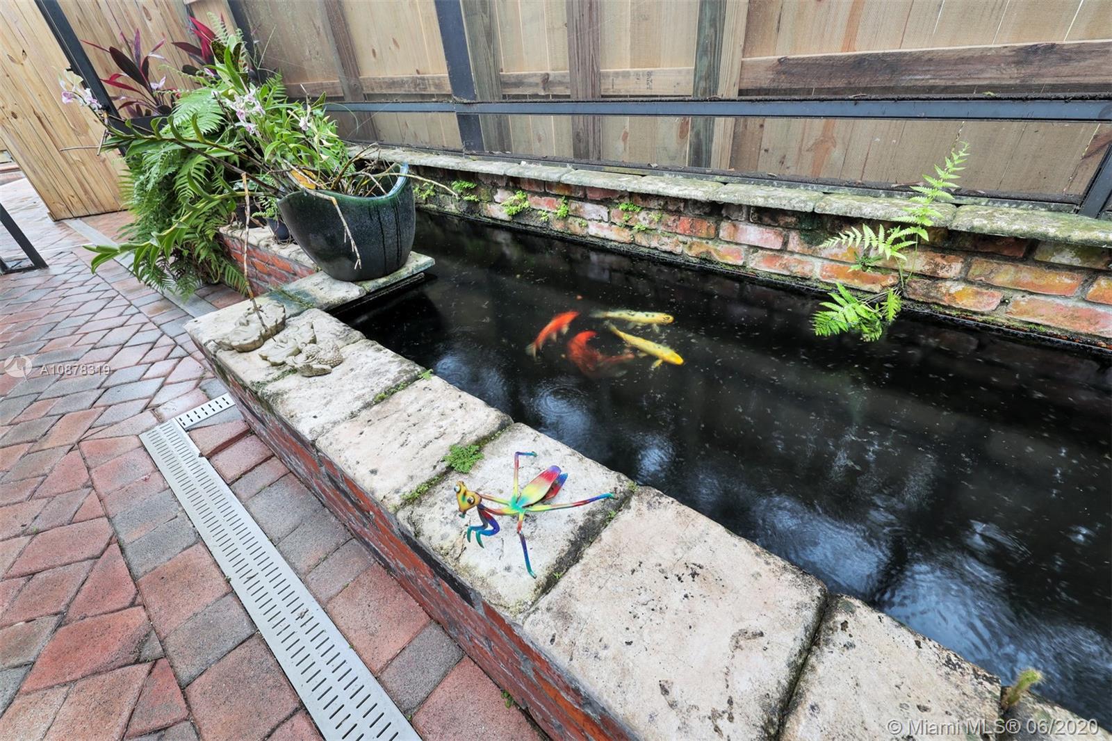 74 Ivy Road Hollywood, FL 33021 - Photo 25 of 55 a picture of a bench in patio