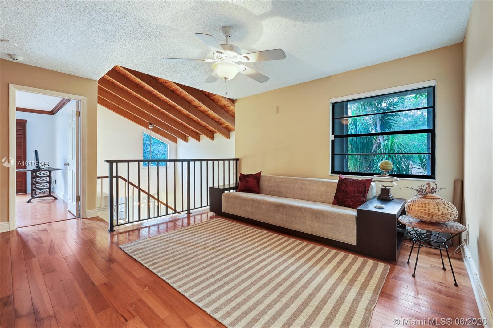 74 Ivy Road Hollywood, FL 33021 - Photo 32 of 55 a living room with furniture and a wooden floor
