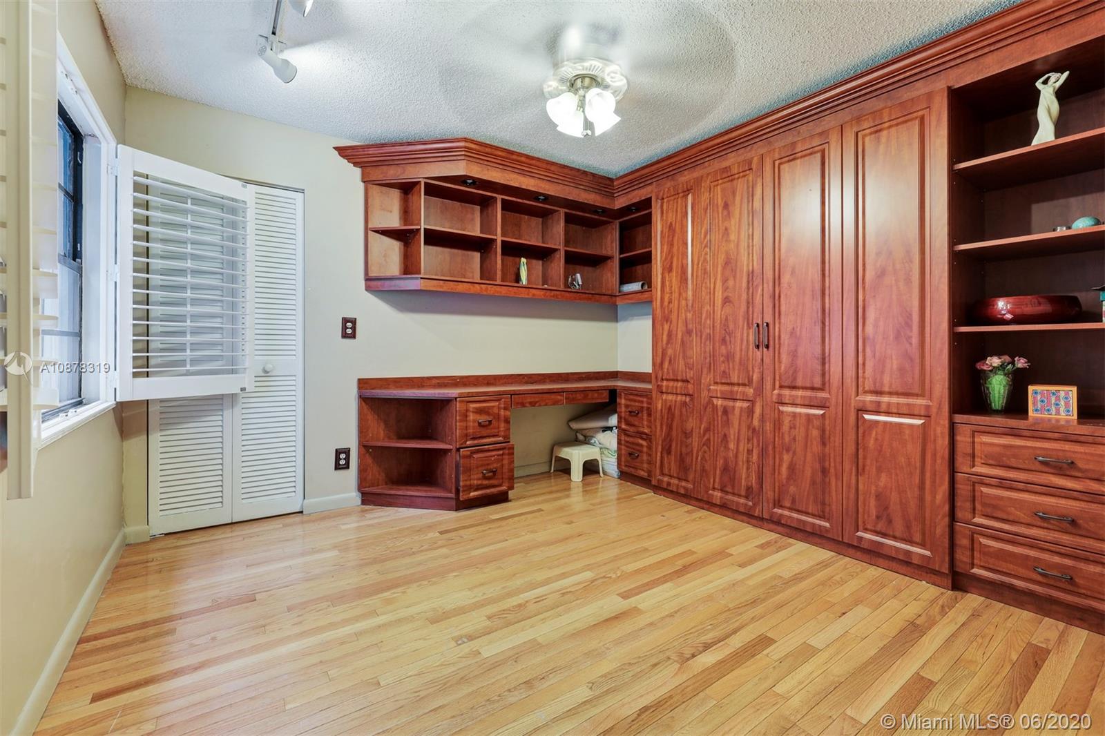74 Ivy Road Hollywood, FL 33021 - Photo 34 of 55 a room with furniture and wooden floors