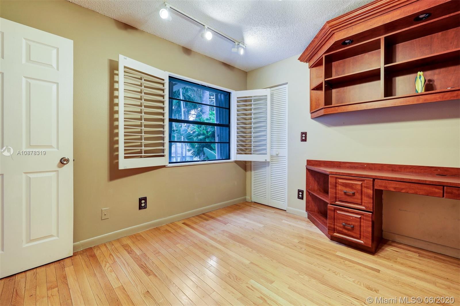 74 Ivy Road Hollywood, FL 33021 - Photo 35 of 55 a room with a bed and a window