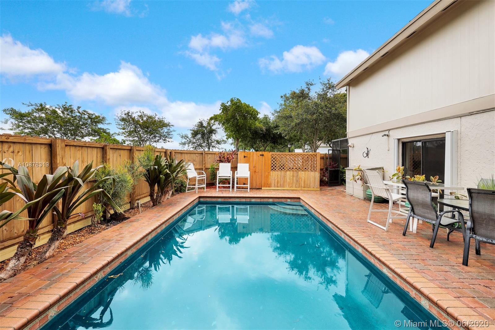 74 Ivy Road Hollywood, FL 33021 - Photo 41 of 55 a view of a swimming pool with outdoor seating