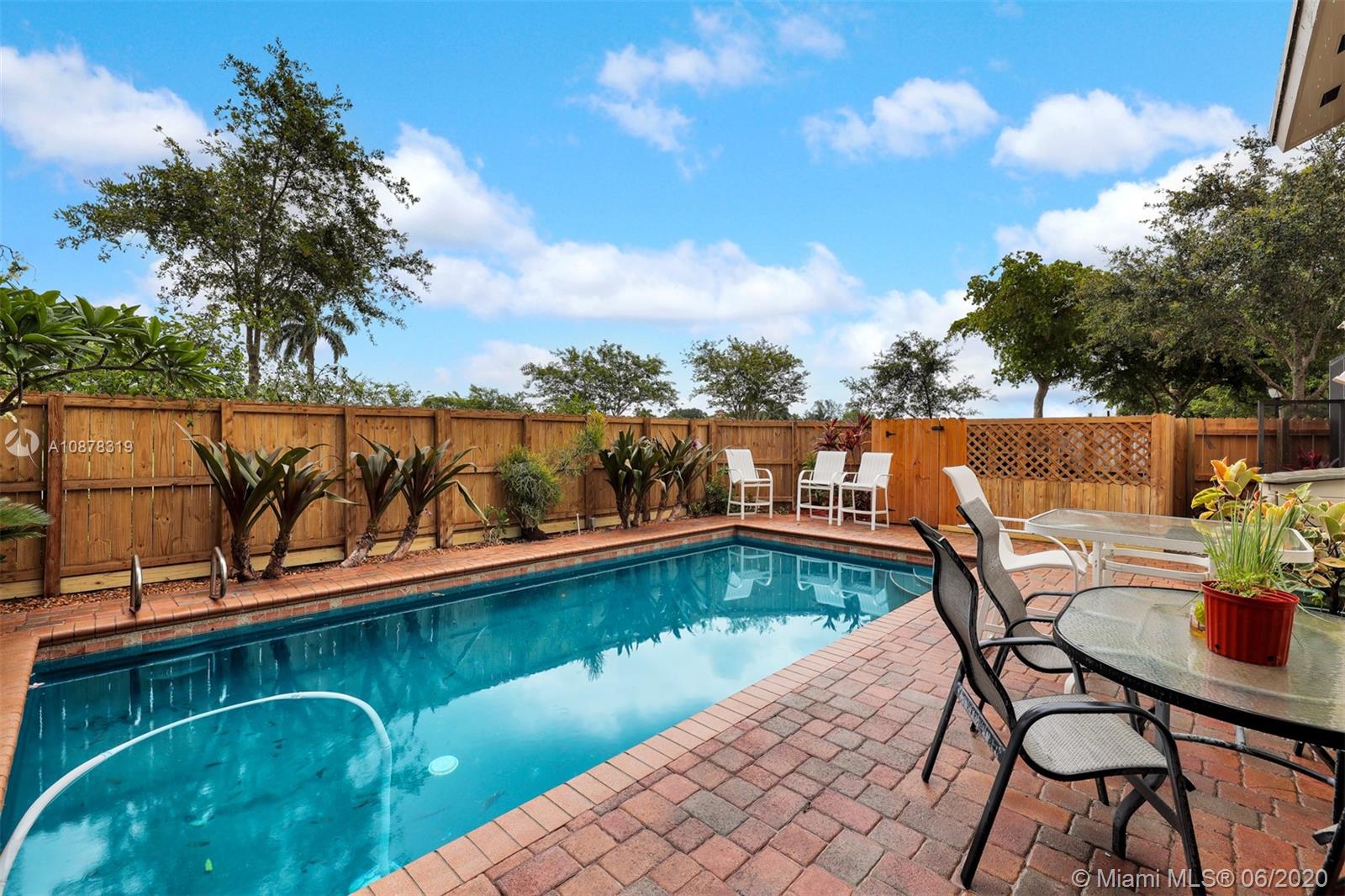 74 Ivy Road Hollywood, FL 33021 - Photo 42 of 55 a view of a lake with couches chairs