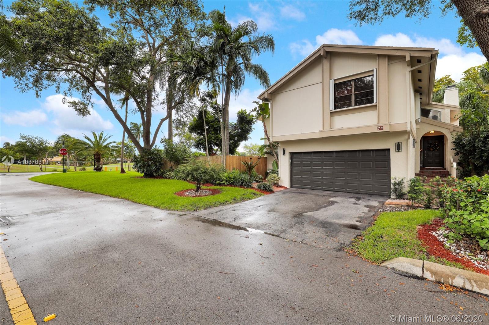 74 Ivy Road Hollywood, FL 33021 - Photo 47 of 55 a view of a house with a yard and palm trees