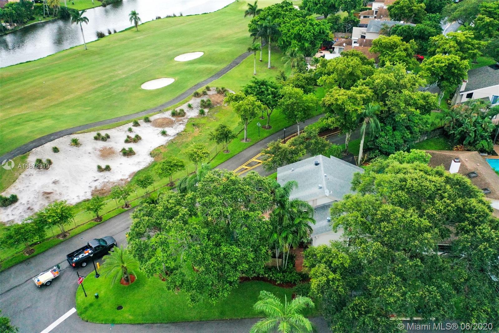 74 Ivy Road Hollywood, FL 33021 - Photo 50 of 55 an aerial view of a golf course with a lake view