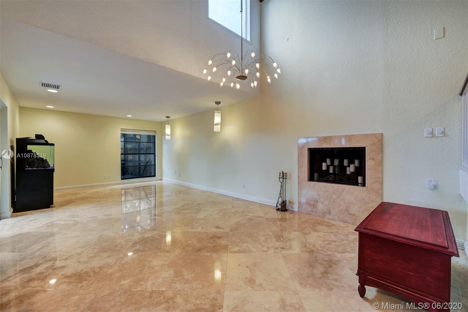 74 Ivy Road Hollywood, FL 33021 - Photo 5 of 55 a view of a livingroom with a fireplace