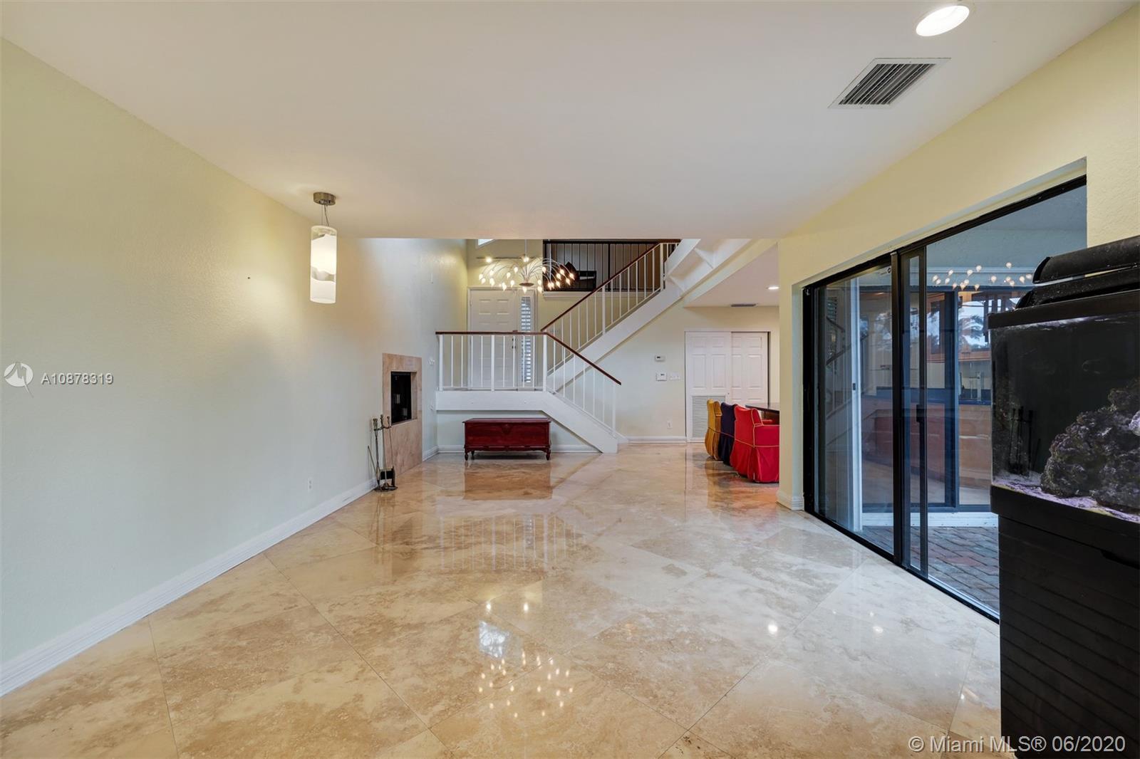 74 Ivy Road Hollywood, FL 33021 - Photo 7 of 55 a view of a livingroom with wooden floor and staircase