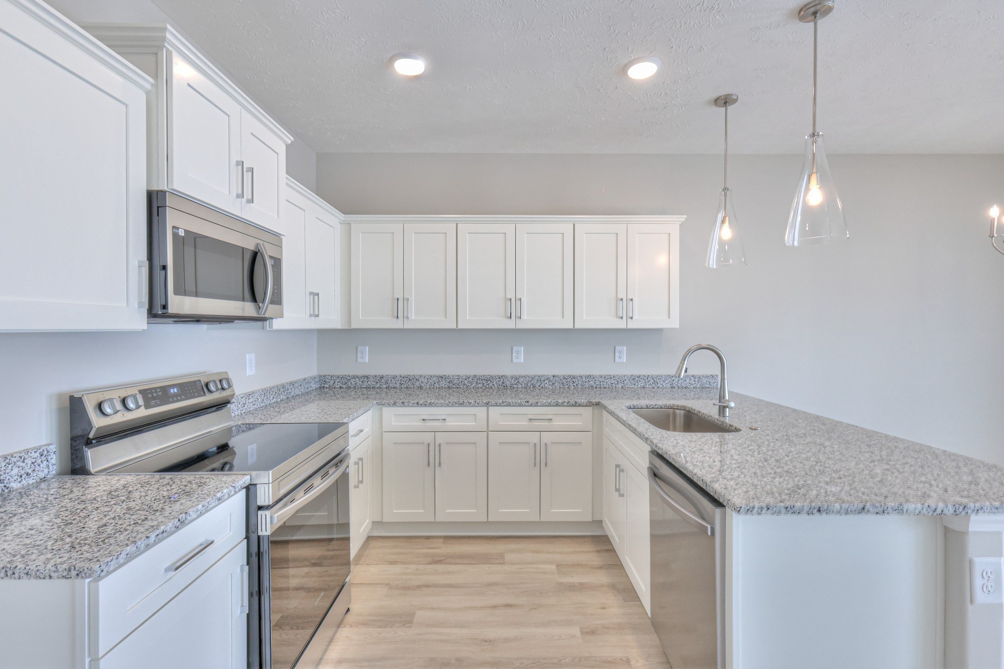 25 Hardwood Road Normandy, TN 37360 - Photo 13 of 28 a kitchen with granite countertop a sink a counter space appliances and cabinets