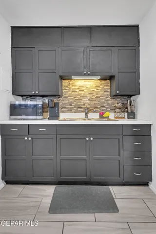 a kitchen with a cabinets and window