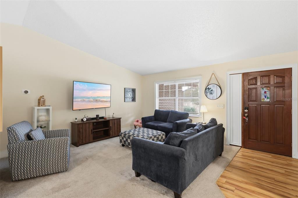 244 Angeles Road DeBary, FL 32713 - Photo 7 of 41 a living room with furniture and a flat screen tv