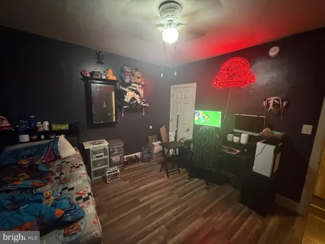 a view of a dining room with furniture wooden floor and chandelier