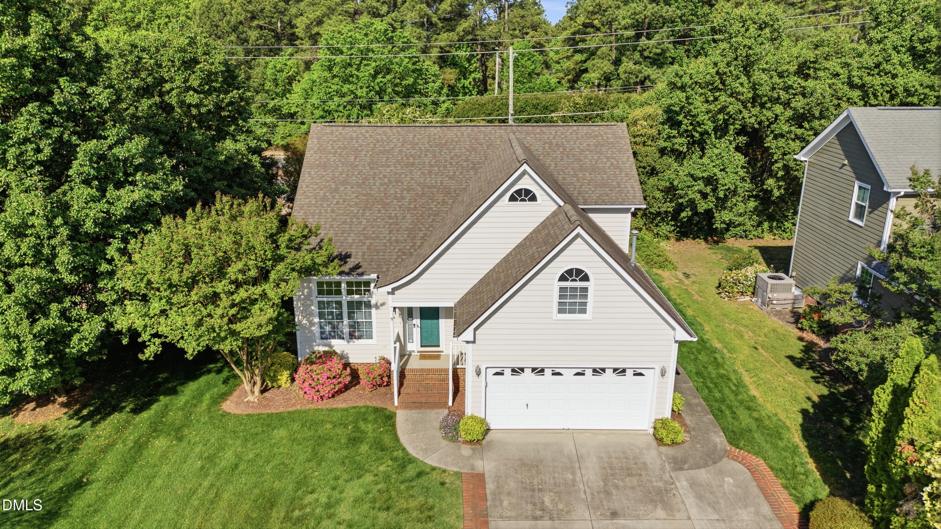 6801 Lynnoak Drive Raleigh, NC 27613 - Photo 25 of 30 an aerial view of a house with swimming pool and garden
