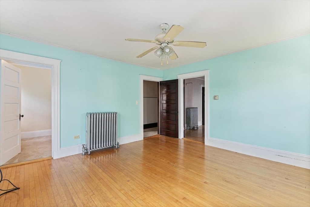 98 Webster Street Haverhill, MA 01830 - Photo 30 of 42 a view of an empty room with wooden floor