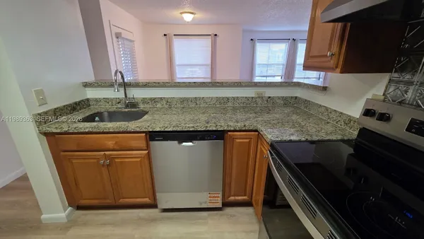 a view of a patio with couple of chairs