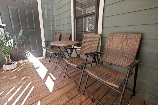 a patio with table and chairs