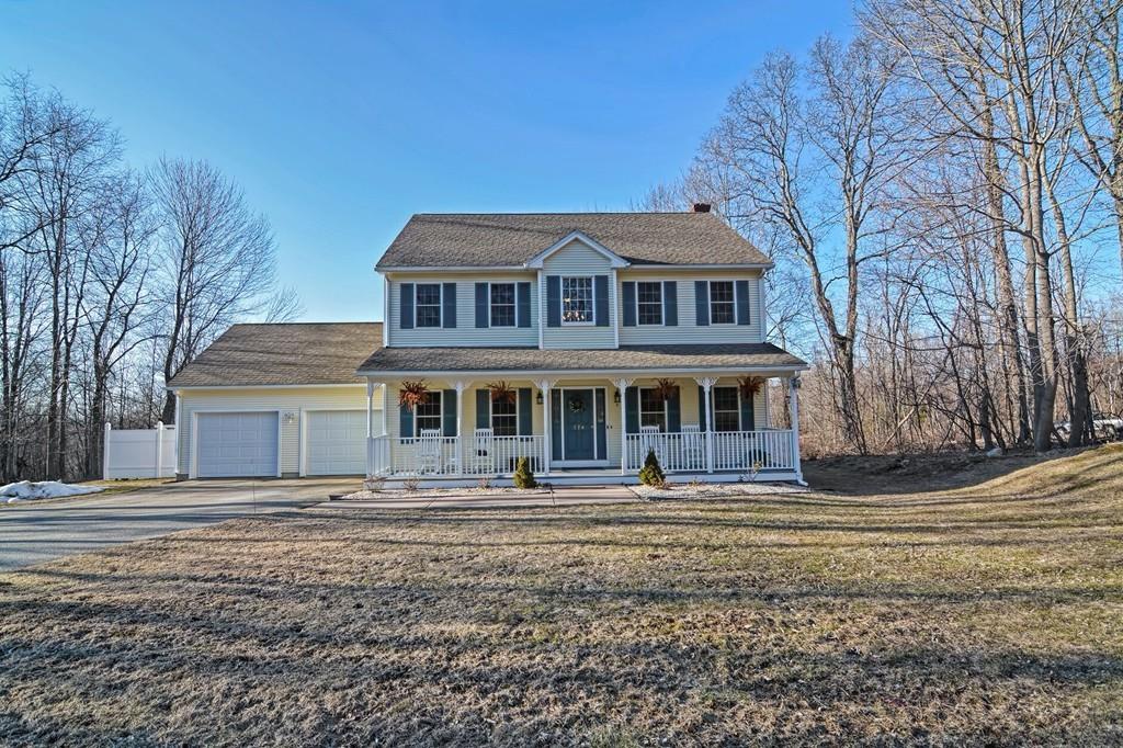774 Reed Street Warren, MA 01092 - Photo 1 of 42 a front view of a house with a garden