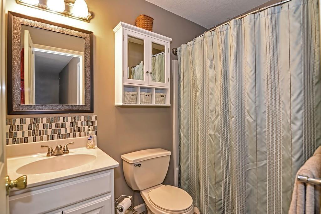 774 Reed Street Warren, MA 01092 - Photo 32 of 42 a bathroom with a toilet a sink and a mirror
