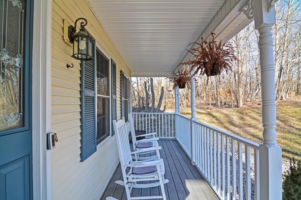 774 Reed Street Warren, MA 01092 - Photo 40 of 42 a view of a porch with wooden floor and stairs