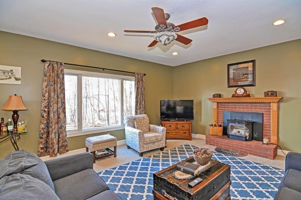 774 Reed Street Warren, MA 01092 - Photo 8 of 42 a living room with furniture a flat screen tv and a fireplace