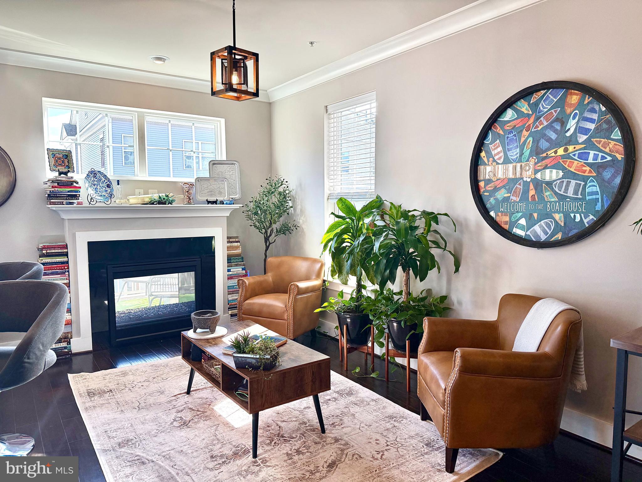 120 Waterline Court Annapolis, MD 21401 - Photo 11 of 38 a living room with furniture a potted plant and a fireplace