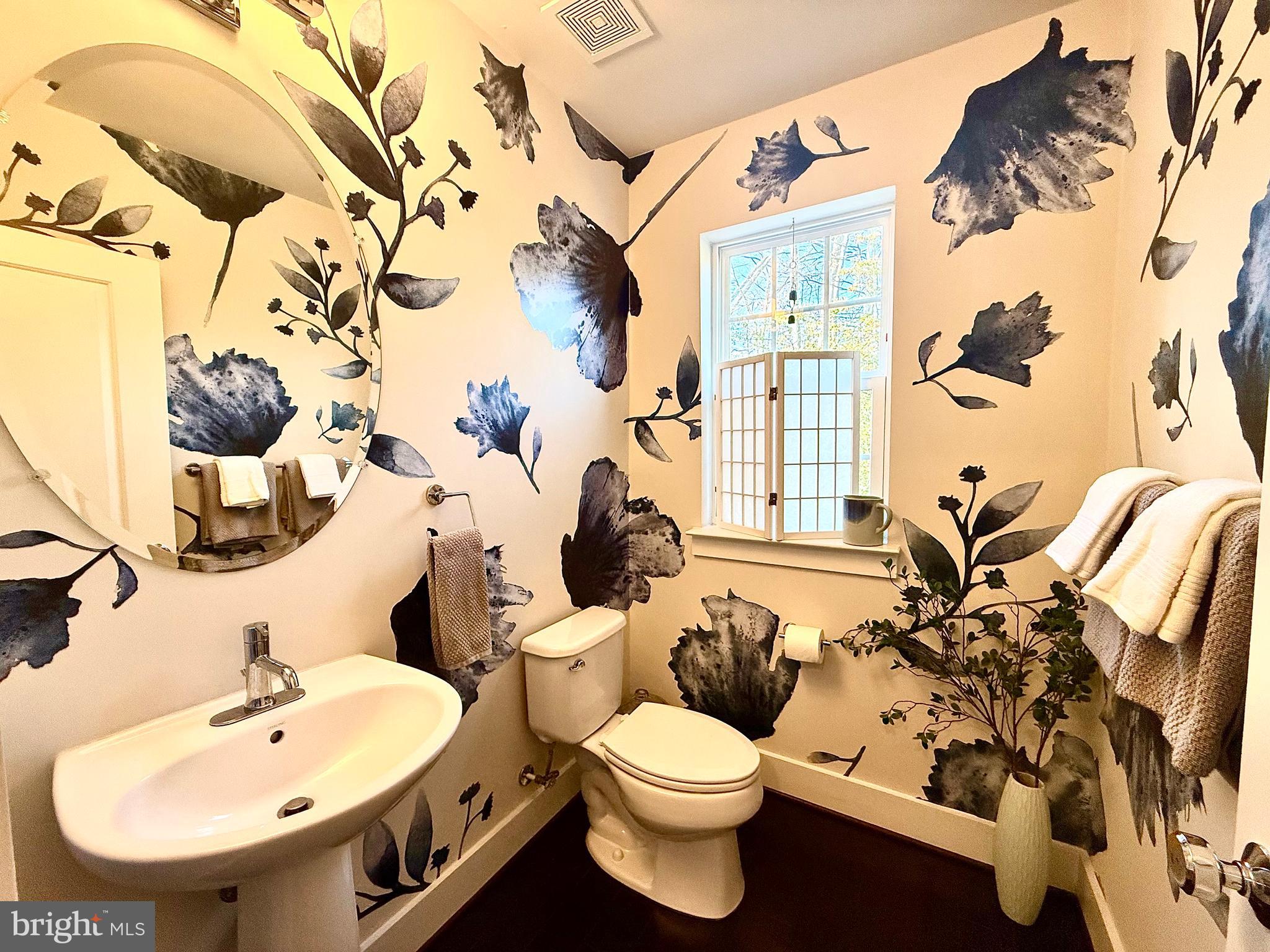 120 Waterline Court Annapolis, MD 21401 - Photo 19 of 38 a bathroom with a toilet sink and mirror