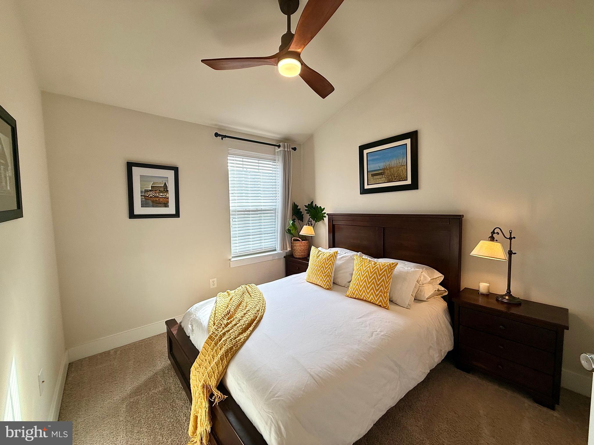 120 Waterline Court Annapolis, MD 21401 - Photo 22 of 38 a bedroom with a bed and a lamp