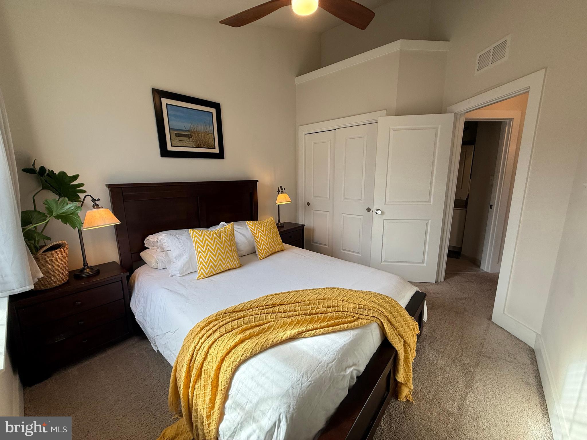 120 Waterline Court Annapolis, MD 21401 - Photo 23 of 38 a bed sitting in a bedroom and a chandelier