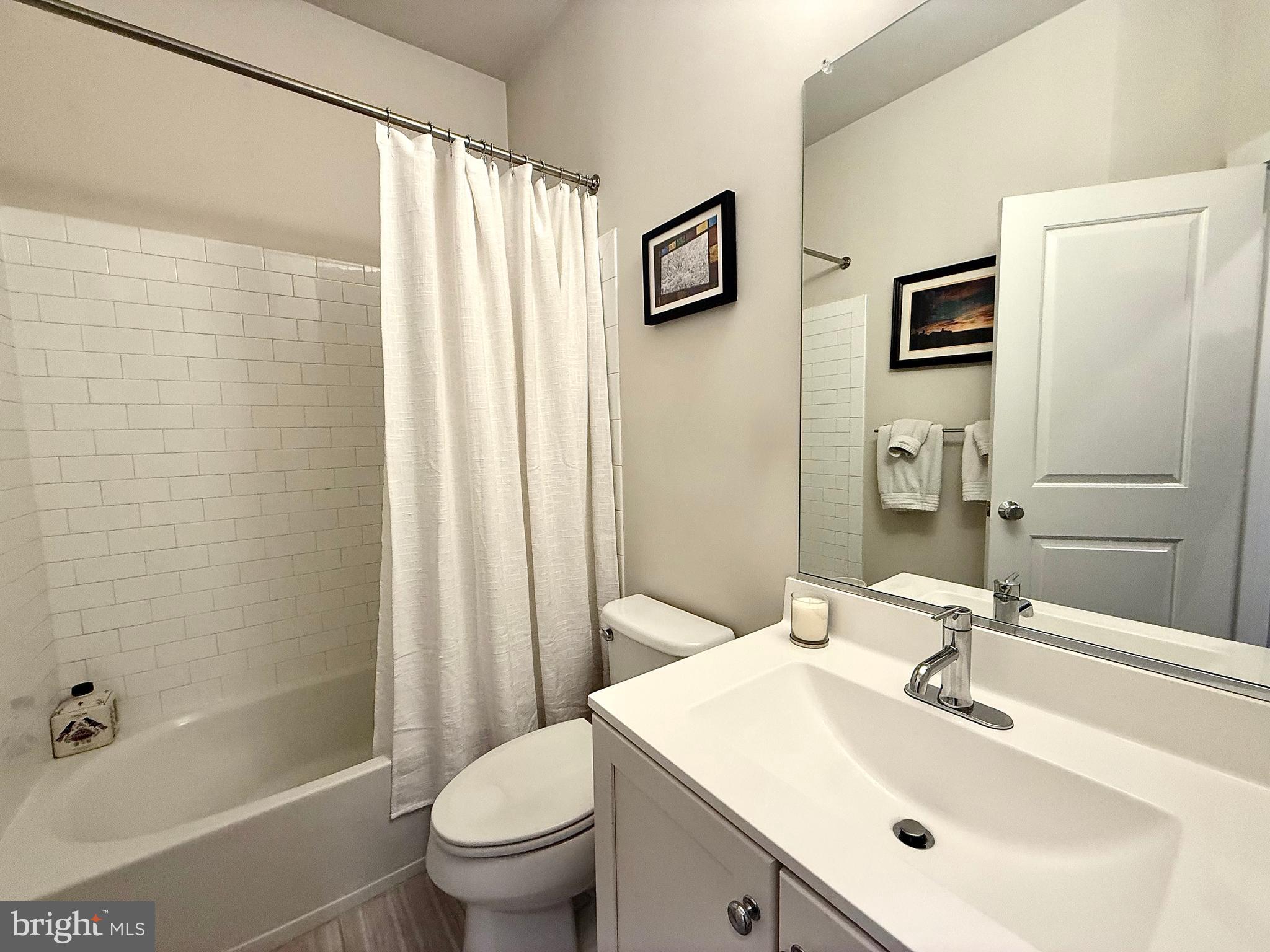 120 Waterline Court Annapolis, MD 21401 - Photo 26 of 38 a bathroom with a sink toilet and shower