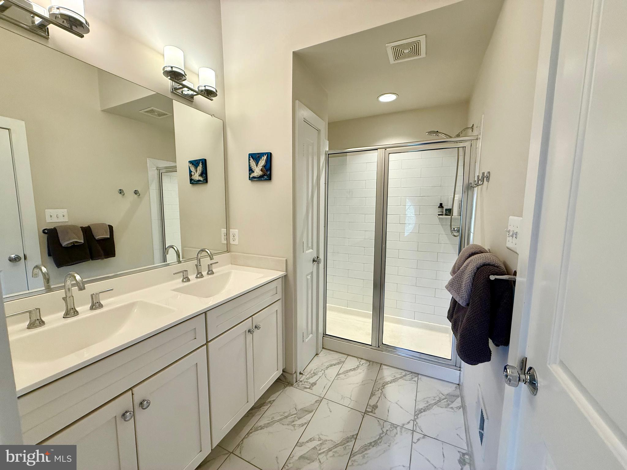 120 Waterline Court Annapolis, MD 21401 - Photo 31 of 38 a bathroom with a sink double vanity and a mirror