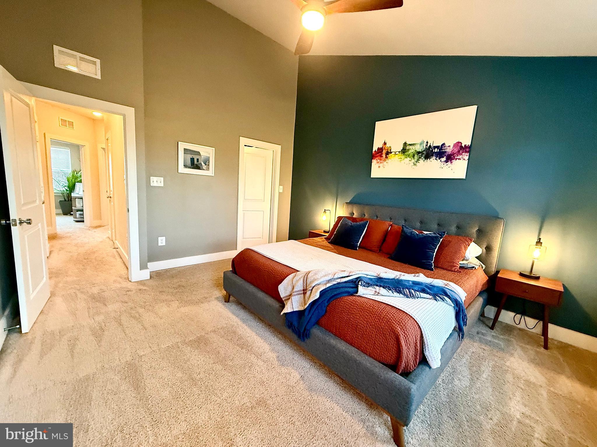 120 Waterline Court Annapolis, MD 21401 - Photo 33 of 38 a bedroom with a bed and a painting on the wall