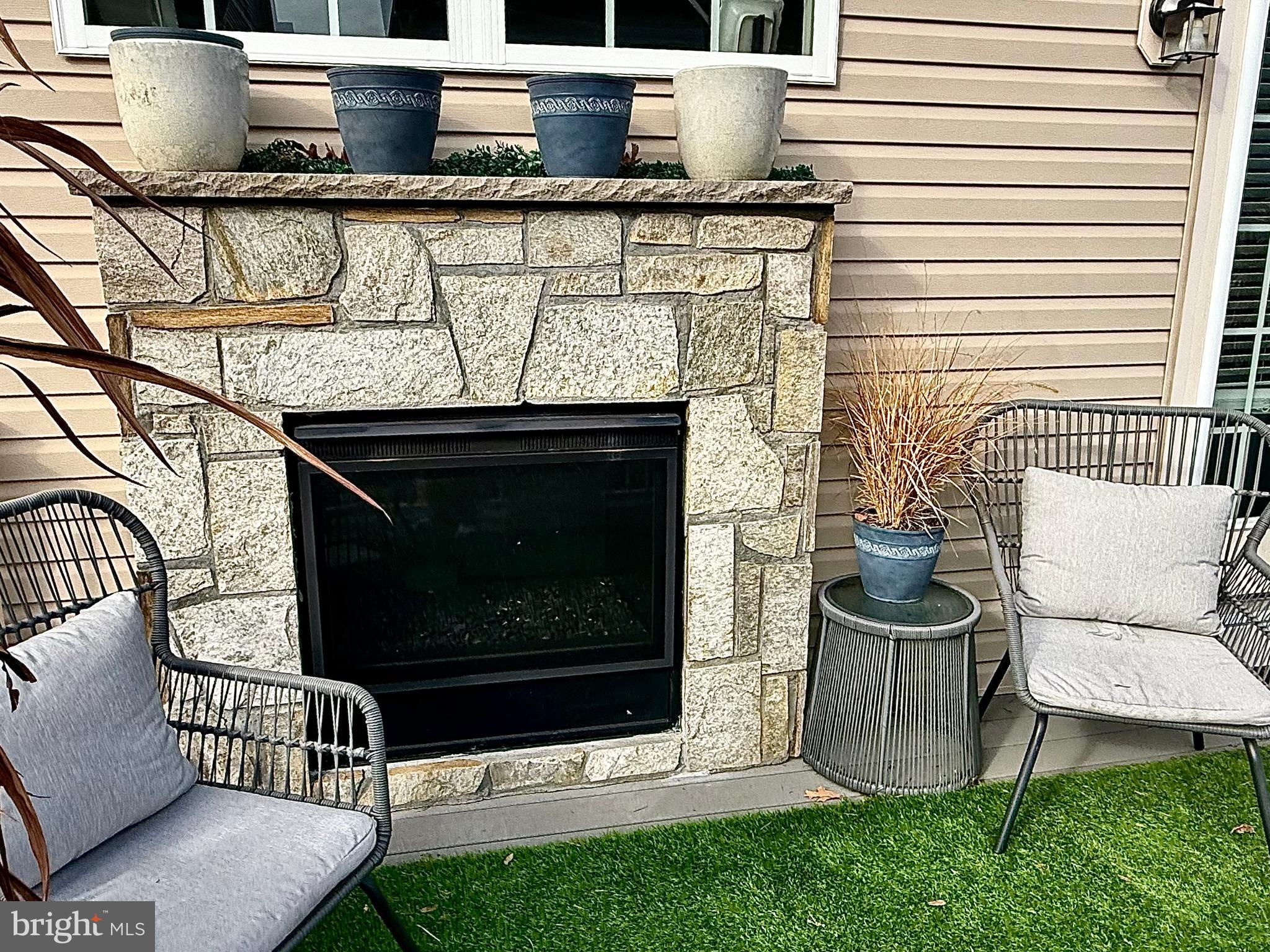 120 Waterline Court Annapolis, MD 21401 - Photo 36 of 38 a living room with furniture a rug and a fireplace