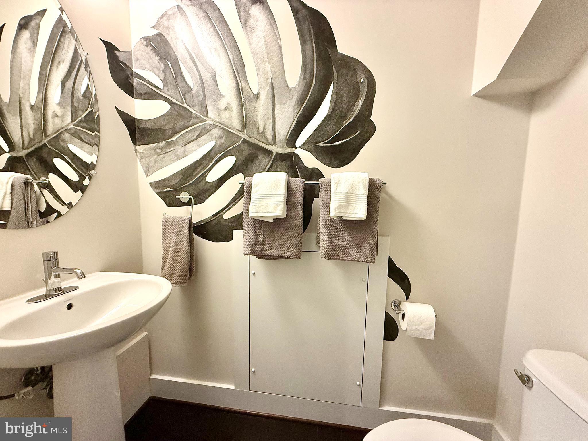 120 Waterline Court Annapolis, MD 21401 - Photo 6 of 38 a bathroom with a sink and mirror with toilet