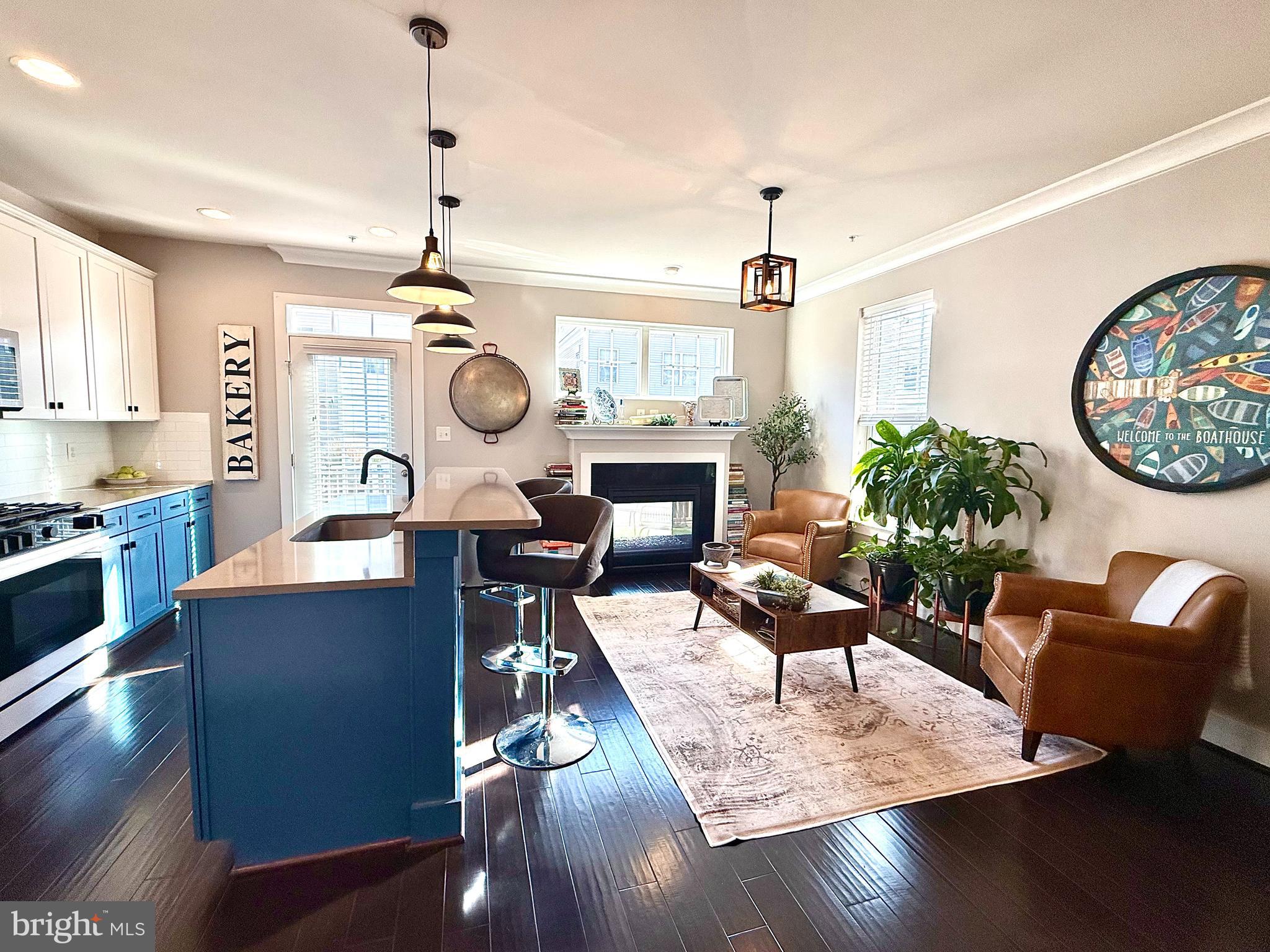 120 Waterline Court Annapolis, MD 21401 - Photo 7 of 38 a living room with fireplace furniture and a chandelier