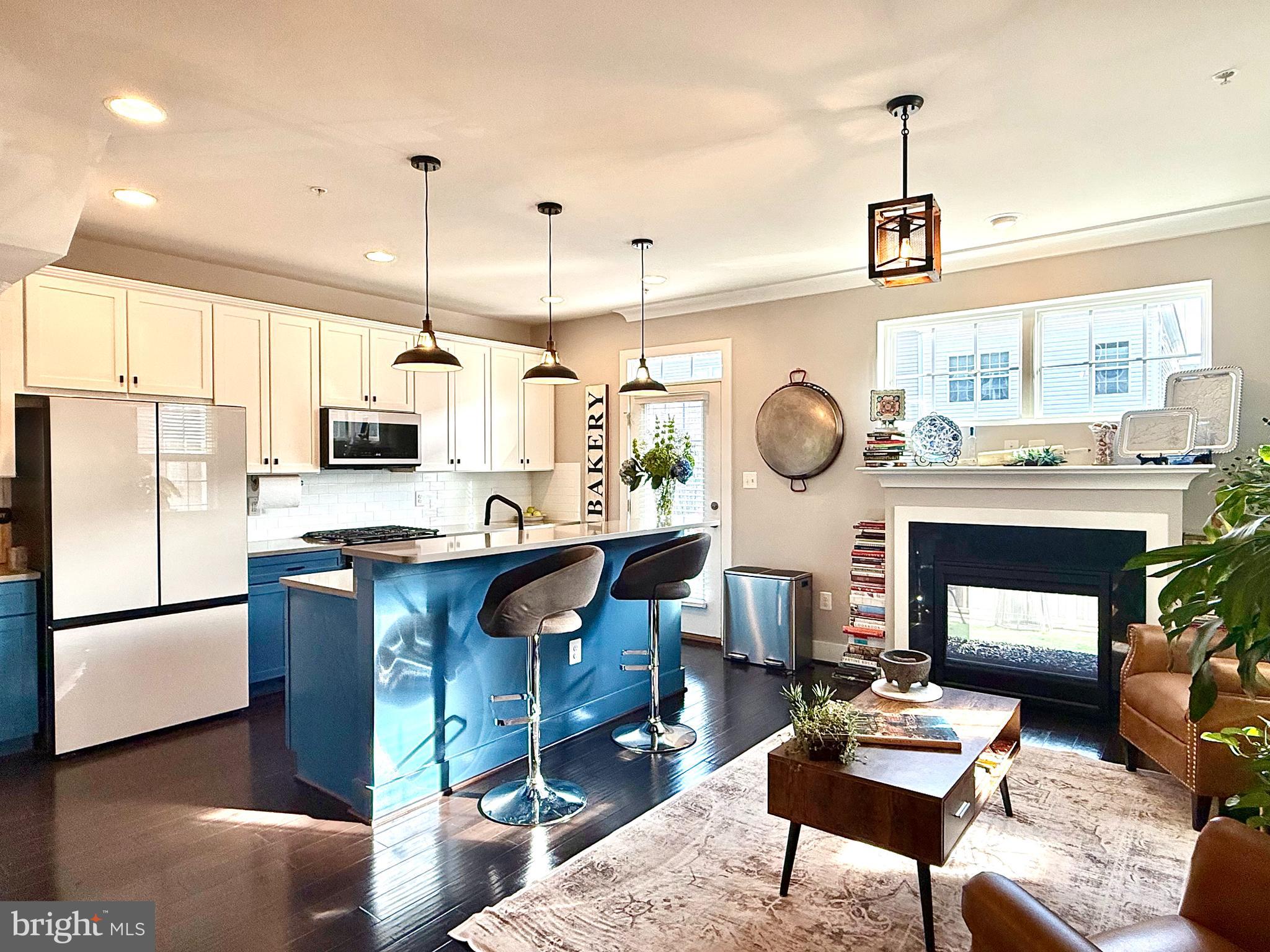 120 Waterline Court Annapolis, MD 21401 - Photo 8 of 38 a living room with furniture a rug and kitchen view